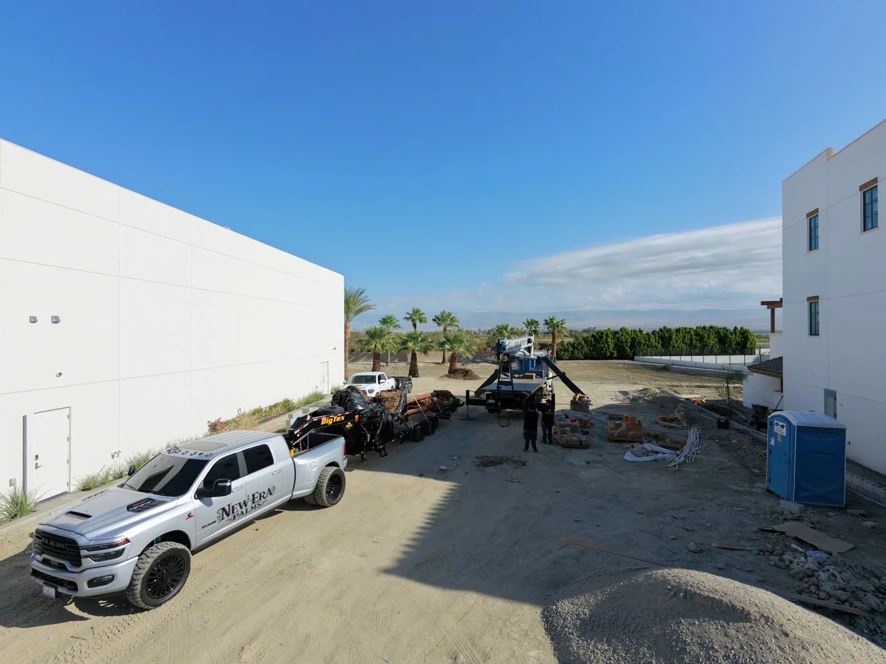 New Era Palms truck, palm trailer, and equipment at the Thermal Racetrack commercial project
